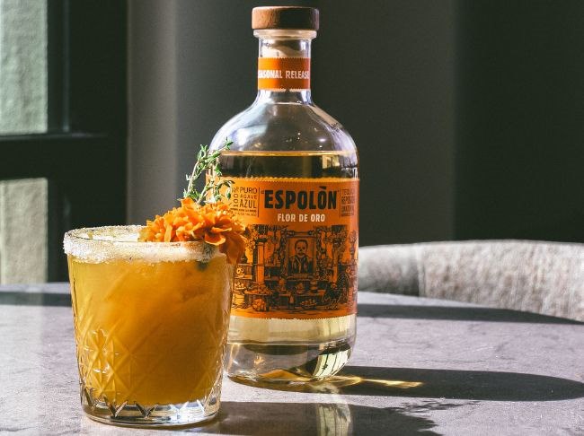 Cocktail and Epsolon Tequila on table